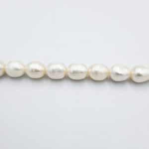 פנינים אמיתיות מתורבתות אורז 7X5.5ממ, חור 1 מ"מ, כ-40 ס"מ בשורה