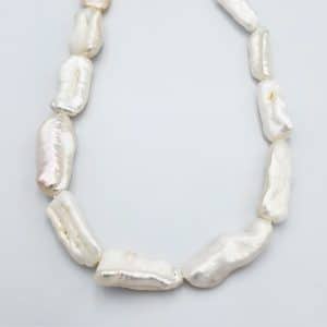 פנינים אמיתיות מתורבתות 20X10ממ, חור 1 מ"מ, כ-40 ס"מ בשורה